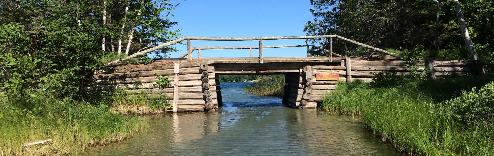approaching-an-old-timber-bridge-and-entering-lake
