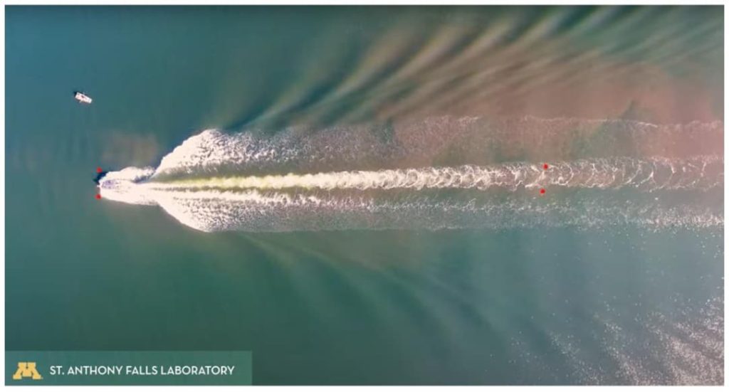 topdown drone shot of a wake boat in operation